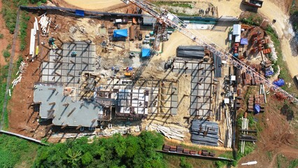 Construction site aerial view: building framework, materials, and equipment