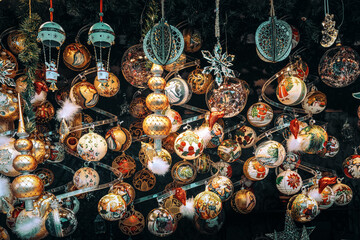 Handmade Christmas baubles hangs from a stall ceiling at the Vienna Christmas market.