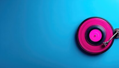 Bright pink record spins on turntable against a vibrant blue background.