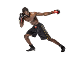Muscular male boxer throwing dynamic forward punch in fighting stance wearing red gloves, isolated on a transparent background