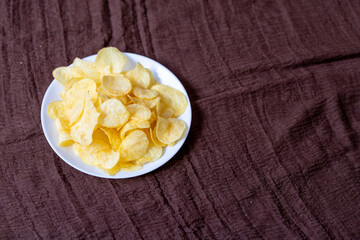 Close-Up of Potato Chips on a Brown Surface