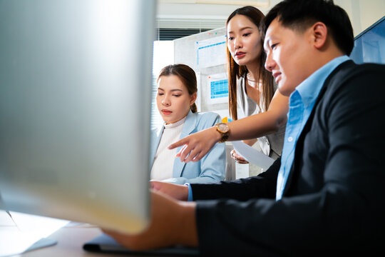 creative Business designer applaud for job success at meeting at office.Planning and brainstorm strategy is the first step.shot of a group of young Asian business people planning on a glass board.