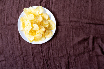Close-Up of Potato Chips on a Brown Surface