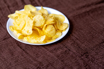 Close-Up of Potato Chips on a Brown Surface