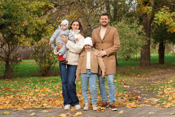 Fototapeta premium Happy family in park on autumn day