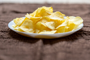 Close-Up of Potato Chips on a Brown Surface