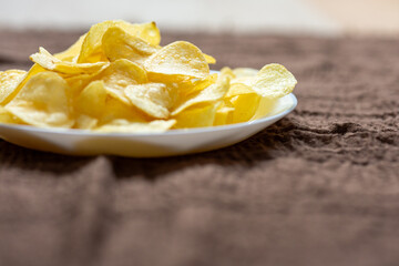 Close-Up of Potato Chips on a Brown Surface