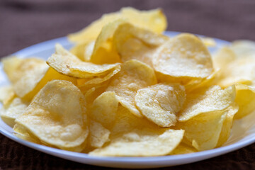 Close-Up of Potato Chips on a Brown Surface