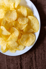 Close-Up of Potato Chips on a Brown Surface