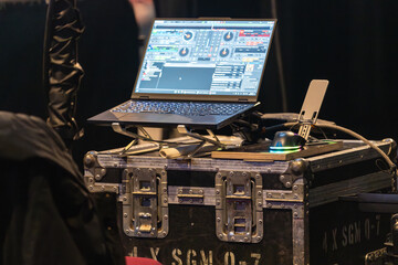 Sound and lighting engineers equipment set up in a concert venue before the show, ready for managing audio and visual effects during the performance
