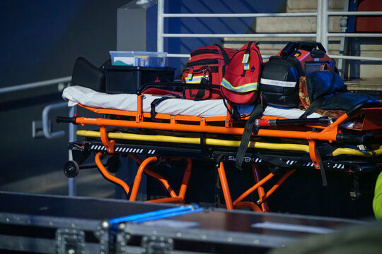 Medical paramedic equipment placed backstage during a concert event for emergency response and safety support of crew and performers - Powered by Adobe