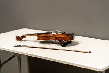 Violin resting on a table before the show, prepared for a live concert performance or musical rehearsal backstage