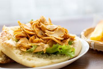 Close-Up of Turkish Chicken Doner Served with French Fries in Bread
