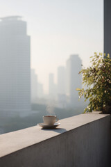 peaceful breakfast scene on balcony overlooking bustling city with solitary cup of coffee