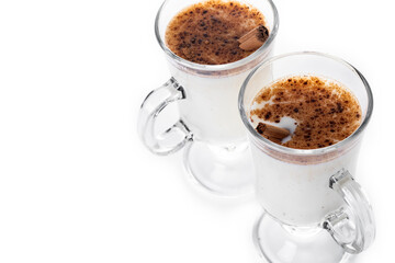 Eggnog with Cinnamon in glass isolated on white background. Christmas drink