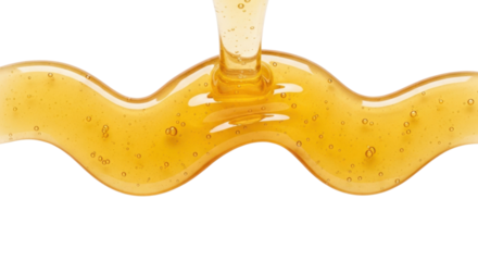 Thick golden honey stream pouring down forming a beautiful wavy line with small bubbles