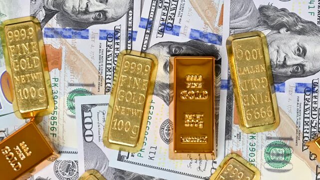 hundred dollar bills with gold bars