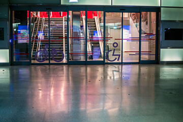 Round candelabra with lit candles in a Catholic cathedral. Religious holiday