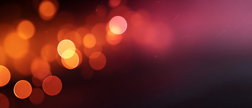 Abstract background with warm orange and red bokeh lights creating a soft glowing effect on a dark gradient surface