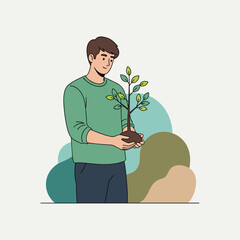 Smiling man holding young tree with eco concept text