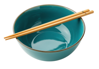 Isolated turquoise ceramic bowl with wooden chopsticks, a modern kitchenware concept