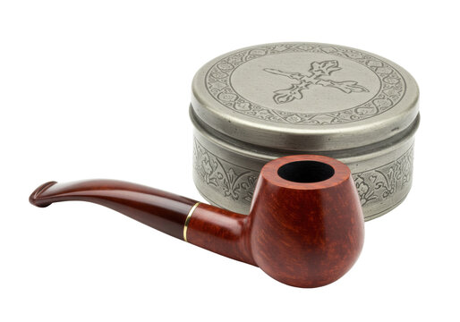Isolated tobacco pipe next to metal snuff box with Christian cross symbol on the lid studio shot