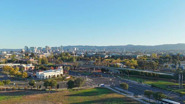 The drone glides over Webster Street in West Alameda, showcasing the neighborhood&rsquo;s vibrant storefronts and the gentle flow of traffic below.