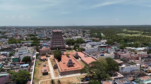 Aerial view of Tenkasi town, Tamil Nadu, showcasing the magnificent Kasi Viswanathar Temple with its towering gopuram surrounded by lush greenery and traditional town buildings.