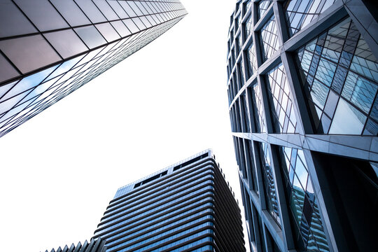 Modern architecture skyscraper in Paris with angular glass facade and corporate reflection structure under clear sky showing urban design and contemporary city innovation