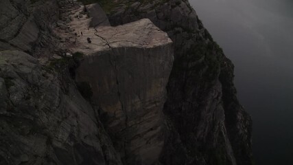 Aerial view of the dramatic Preikestolen cliff, its sharp edges contrasting with the softer textures of the surrounding landscape, Songesand, Rogaland, Norway.