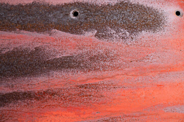 Very old orange metal door with rusty texture