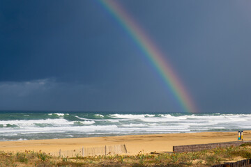 rainbow over the sea, surf and waves