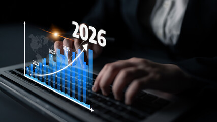 A business professional analyzes growth projections from 2023 to 2026 using advanced data charts...