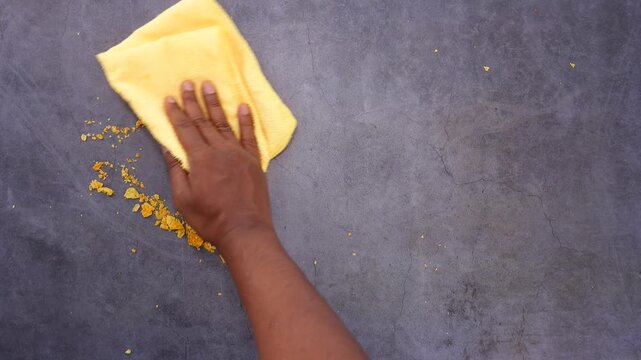 Cleaning up turmeric spills in a kitchen setting