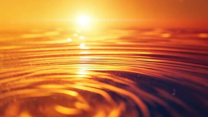 Golden water ripples radiating warmth at sunset