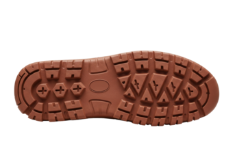 Isolated brown rubber shoe sole with tread for hiking or trekking, textured outdoor footwear