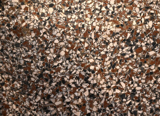 Unique terrazzo floor with colorful stones and patterns in a modern interior design setting