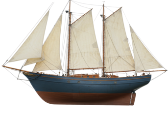 Isolated model sailboat on display with tan sails and blue hull in nautical theme style