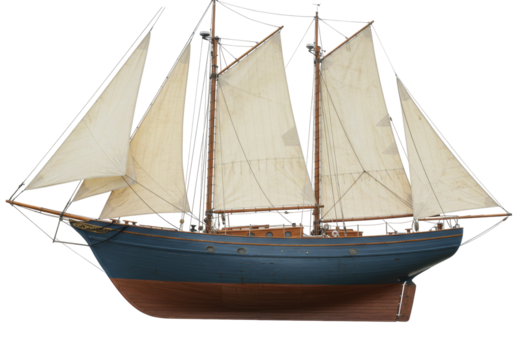 Isolated model sailboat on display with tan sails and blue hull in nautical theme style