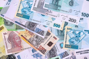 Congolese franc money bills in big amount on table close up. Rich life concept in Democratic Republic of Congo. Business and economy