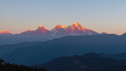 Panoramic sunset view over snow-covered Panchchuli peaks in the Great Himalayan mountain range, seasonal change