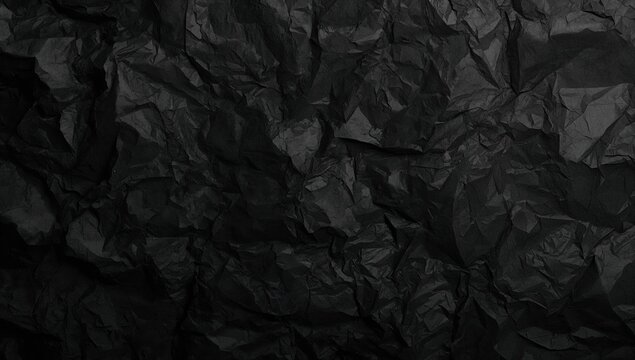 Surface of dark crinkled paper with irregular folds - Powered by Adobe