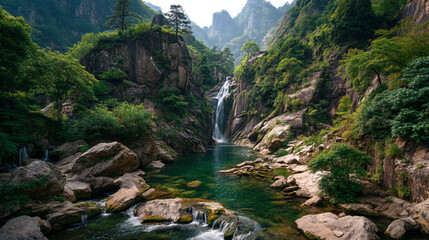 Waterfall cascading into a clear pool surrounded by lush greenery and rocks