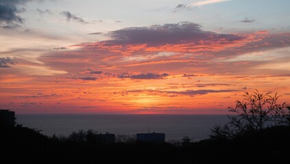 Fototapeta premium The sunset over the horizon, showcasing seasonal change