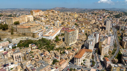 Fototapeta premium Aerial view of the historic center of Agrigento, Sicily, Italy. This Sicilian capital, located on a hilltop, was known in ancient times as Akragas. It's a beautiful, sunny summer day.