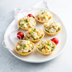 Traditional Russian salad served in tartlets