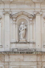 San Giacomo Apostolo Church Facade Close Up with Madonna Statue in Udine, Italy