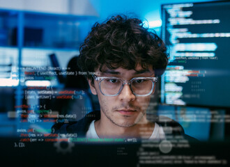 Professional Male Software Developer Working on Computer Screen, Showing Digital Programming Code, Frontend Web Development, Concept of IT Engineering, Modern Technology, and Deep Analysis in office.