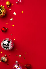 Festive Christmas ornaments on a red background.