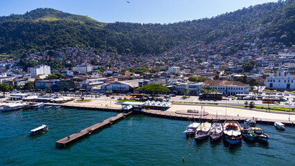 Favela Houses at Port City Fishing Boats And Fishermen Working Sea Shore Angra Dos Reis Rio De...
